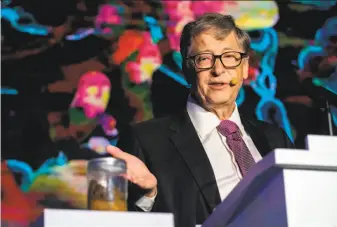  ?? Nicolas Asfouri / AFP / Getty Images ?? Microsoft founder Bill Gates put poop at center stage to make a point at the “Reinvented Toilet” Expo in Beijing. His foundation has spent more than $200 million on sanitation technology.