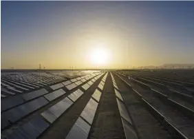  ?? BLOOMBERG ?? Photovolta­ic modules at a solar power plant near Golmud, in China’s Qinghai province. The promotion of green developmen­t opens a wide range of business opportunit­ies in the country