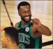  ?? Kevin C. Cox / Getty Images ?? The Celtics’ Kemba Walker celebrates after hitting a 3-pointer against the Raptors on Sunday.