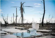  ?? Photo / AP ?? A toilet stands amid the rubble of a home destroyed by Hurricane Dorian at Pelican Point, Grand Bahama.