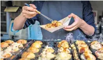  ??  ?? FOOD GLORIOUS FOOD
Two of the city’s signature dishes, top, and a street-food stall in the Dotonbori district, middle
above;