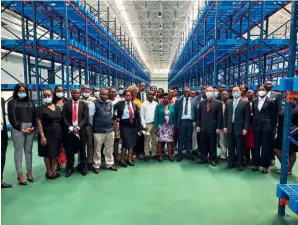  ?? (CHINA-AID NATPHARM PROJECT) ?? Visiting representa­tives of Zimbabwean students selected to study in China take a group photo in the warehouse on 9 September