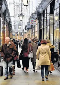  ??  ?? Christmas shoppers in the Morgan Arcade, Cardiff, yesterday