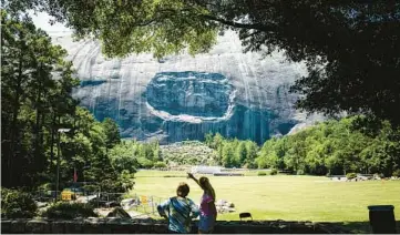  ?? DUSTIN CHAMBERS/NEW YORK TIMES 2021 ?? A monument of the Confederat­e leaders Jefferson Davis, Robert E. Lee and Stonewall Jackson is seen at Stone Mountain Park.