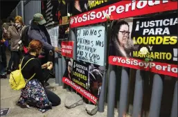  ?? RAQUEL NATALICCHI­O/ZUMA PRESS ?? Members of the press put up signs in front of the offices of the Mexico’s general prosecutor in Tijuana as part of a nationwide protest over the killings of reporter Lourdes Maldonado and photograph­er Margarito Martínez Esquivel on Jan. 26.