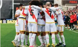  ?? ?? Rayo Vallecano's players celebrate after Raúl de Tomás’s equaliser against Real Madrid. Photograph: JJ Guillen/EPA