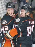 ??  ?? ONDREJ KASE, right, celebrates with Ducks teammate Josh Manson after scoring in the second period against Nashville.