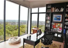  ?? Photos by Robin Jerstad / Contributo­r ?? Just about every room in the house, including the two home offices, has large windows and is oriented to take advantage of the view.