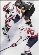  ?? Benjamin Hager ?? Las Vegas Review-journal Golden Knights forward William Carrier (28) tries to muscle Washington forward Andre Burakovsky (65) off the puck in the first period of Game 5.