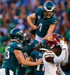  ?? MATT ROURKE/ASSOCIATED PRESS ?? Jake Elliott was flying high after booting a 54-yard field goal, his fourth of the game, in overtime to give the Eagles the win.