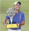  ??  ?? KUALA LUMPUR: Fabrizio Zanotti of Paraguay poses with his trophy after winning the Maybank Championsh­ip golf tournament in Kuala Lumpur, Malaysia yesterday. —AP