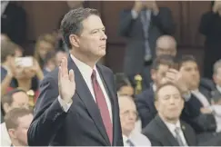  ??  ?? 0 James Comey takes the oath before testifying to the committee