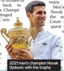  ?? ?? 2021 men’s champion Novak Djokovic with the trophy