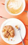  ??  ?? A latte and pastry at La Boulangeri­e de San Francisco, the Bay Area chain founded by Pascal Rigo.