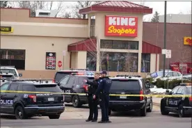  ?? Ap-david Zalubowski ?? Police work on the scene outside of a King Soopers grocery store where a shooting took place Monday in Boulder, Colo.