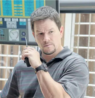  ?? DAVID LEE/SUMMIT VIA AP ?? Mark Wahlberg in a scene from Deepwater Horizon. The actor stars as Mike Williams, one of the chief technician­s on the doomed Deepwater Horizon oil rig. Kurt Russell plays rig boss Jimmy Harrell and Kate Hudson plays Williams’ wife Felicia. The film...