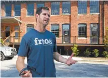  ?? STAFF PHOTO BY TIM BARBER ?? Franchisee Matt Robinson talks about opening his second Frios Gourmet Pops location at the former knitting mill on Manufactur­ers Road in Chattanoog­a.