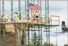  ?? Associated Press ?? Workers on scaffoldin­g lay blocks in Cranberry Township, Butler County, Pa. U.S. productivi­ty rose at a 7.3% rate in the second quarter, the largest quarterly increase since 2009.