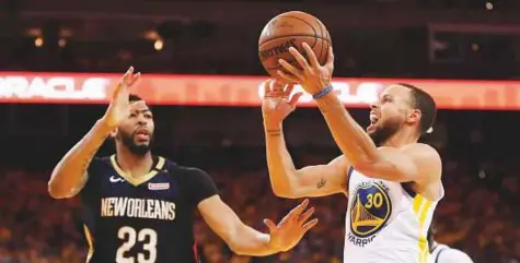  ?? AFP ?? Stephen Curry (No 30) of the Golden State Warriors goes up for a shot during Game Five of the Western Conference semi-finals against New Orleans Pelicans in the 2018 NBA play-offs in Oakland, California, on Tuesday.