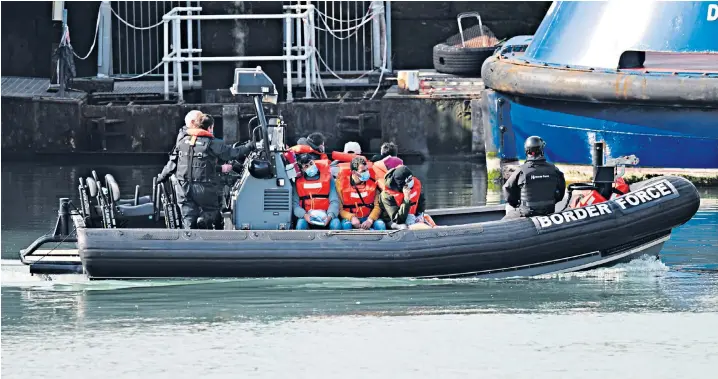  ??  ?? A Border Force boat carrying migrants at Dover yesterday