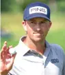  ?? Andy Clayton King/AP ?? ■ Michael Thompson acknowledg­es the sparse crowd Sunday after a birdie on the 12th during the final round of the 3M Open in Blaine, Minn.