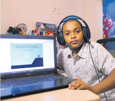  ?? RICARDO MAKYN/CHIEF PHOTO EDITOR ?? Eleven-year-old Dominic Darby shows off the game he created to conquer hundreds of rivals across 70 countries in a coding competitio­n sponsored by XPRIZE.