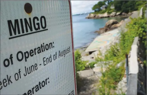  ?? (AP/Steven Senne) ?? An advisory lists the name Mingo on a sign June 15 at an entrance to Mingo Beach in Beverly, Mass. The beach was named after enslaved African American Robin Mingo, who according to legend, was promised his freedom if the tide ever receded enough for him to walk out onto a rocky ledge offshore that becomes exposed at low tide.