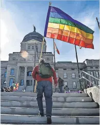  ?? THOM BRIDGE/ AP ?? Demonstrat­ors gather on the steps of the Montana State Capitol protesting proposed anti- transgende­r legislatio­n.