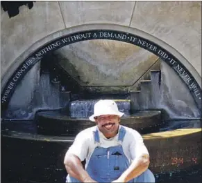  ?? Courtesy of Erin Aubry Kaplan ?? ERIC PRIESTLEY, in the 1990s, at the Grotto fountain at L.A.’s Central Library.