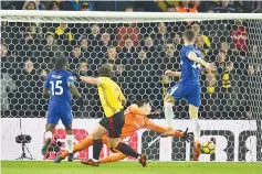  ?? — AFP photo ?? Watford’s Dutch defender Daryl Janmaat (2L) scores past Chelsea’s Belgian goalkeeper Thibaut Courtois during the English Premier League football match between Watford and Chelsea at Vicarage Road Stadium in Watford, north of London on February 5, 2018.