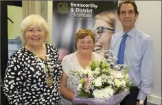  ??  ?? Chamber secretary Margot Banville-Hogan received a special presentati­on from Maree Lyng and Michael O’Leary to mark her retirement from the position.