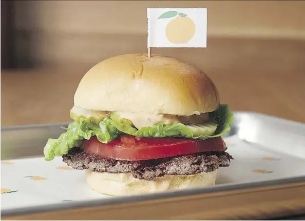  ?? IMPOSSIBLE FOODS INC. ?? The Impossible Burger doesn’t contain any meat. It’s made entirely from vegetation such as wheat, coconuts and potatoes, but it also has a secret ingredient: Heme, the molecule that makes meat taste delicious, which Impossible Foods Inc. recreates by...