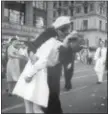  ?? VICTOR JORGENSEN — U.S. NAVY, FILE ?? In this file photo provided by the U.S. Navy, a sailor and a woman kiss in New York’s Times Square, as people celebrate the end of World War II.