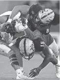  ?? PATRICK BREEN/THE REPUBLIC ?? NAU receiver Coleman Owen is tackled by ASU cornerback Khoury Bethley (15) and linebacker Merlin Robertson (8) on Sept. 1 in Sun Devil Stadium.