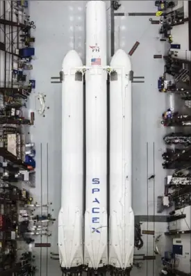  ?? FILE PHOTO ?? This photo made available by SpaceX in December shows the Falcon Heavy rocket in a hangar at Cape Canaveral, Fla. It is scheduled for a test flight this month.