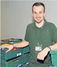  ??  ?? Volunteer Alan has devoted more than 250 hours to the foodbank