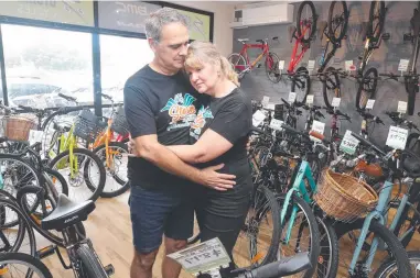  ?? ?? Owners Sheridan and Terry Bosworth at Storm Cycles in Tugun, which is being forced to close down after their landlord proposed a rent rise of almost 45 per cent. Picture: Glenn Hampson