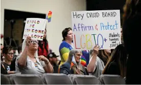  ?? Protecting LGBTQ+ policies. Photograph: Anjali Sharif-Paul/AP ?? Parents, students and staff of Chino valley unified school district hold up signs in favor of