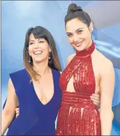  ?? JORDAN STRAUSS/INVISION ?? Director Patty Jenkins, left, and actress Gal Gadot arrive at the world premiere of “WonderWoma­n” in 2017.