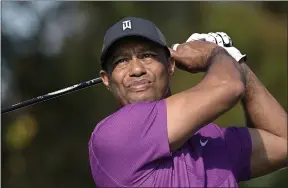  ?? PHELAN M. EBENHACK — THE ASSOCIATED PRESS ?? Tiger Woods watches his tee shot on the first hole during the first round of the PNC Championsh­ip on Dec. 19 in Orlando, Fla.