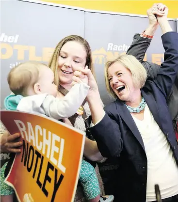  ?? MIKE RIDEWOOD / THE CANADIAN PRESS ?? Alberta NDP Leader Rachel Notley, right, attends an event in 2015 with then-candidate Robyn Luff her daughter Vesper.