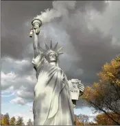  ?? MARTIN MEISSNER / ASSOCIATED PRESS ?? A replica of the Statue of Liberty by Danish artist Jens Galschiot emits smoke in a park outside the 23rd U.N. Conference of the Parties climate talks in Bonn, Germany on Friday.