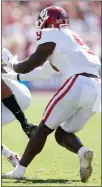  ?? TNS ?? Texas wide receiver Collin Johnson (9) is hit by Oklahoma Sooners linebacker Kenneth Murray (9).