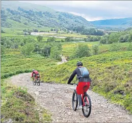  ?? ?? Cyclists take in one of the stunning routes around Ullapool