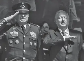 ?? MARCO UGARTE/AP FILE ?? Mexico Defense Secretary Gen. Luis Cresencio Sandoval, left, with President Andres Manuel Lopez Obrador, says seizures of fentanyl soared 525% in the first three years of the current administra­tion, which took office Dec. 1, 2018, compared to the previous three years.