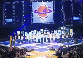 ?? Kristen Balderas/Philadelph­ia Inquirer photos ?? At the end of THON2020, the 46-hour dance-a-thon that raises money for pediatric cancer research and support, students announced the weekend’s tally: $11,696,942.38.