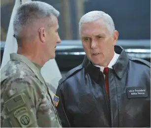  ?? (Mandel Ngan/Pool/Reuters) ?? US VICE PRESIDENT Mike Pence (right) chats with Gen. Nick Nicholson, commander of US forces in Afghanista­n, shortly after arriving at Bagram Air Field in December.