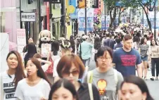  ??  ?? File photo shows consumers shopping in a district of Seoul, South Korea. The country has maintained commendabl­e economic growth averaging 2.8 per cent in the past five years, which outpaced the 1.7 per cent average of developed economies during the same period. — AFP photo