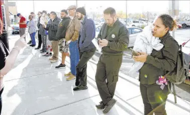  ?? Bizuayehu Tesfaye Las Vegas Review-Journal ?? People wait in line in March at the One-Stop Career Center in Las Vegas.