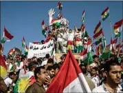  ?? CHRIS MCGRATH / GETTY IMAGES ?? Supporters of Kurdish independen­ce await the arrival of Kurdish President Masoud Barzani in Erbil, Iraq, on Friday. The Iraqi government and neighborin­g countries oppose Monday’s referendum.